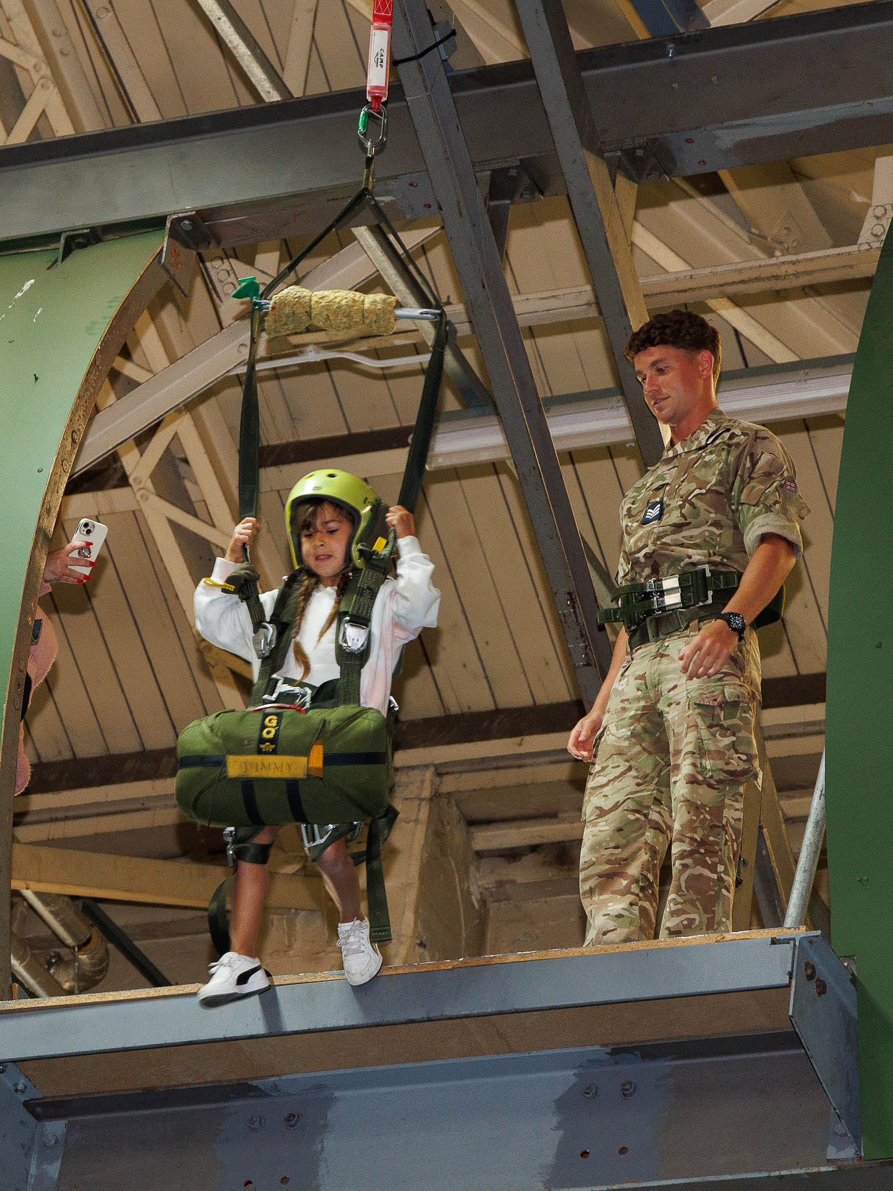 Photo: Members of the Oxfordshire Deaf Childrens Society recently had an unforgettable experience as they visited RAF Brize Norton. Image shows one of the children trying out the Parachute Exit Trainer